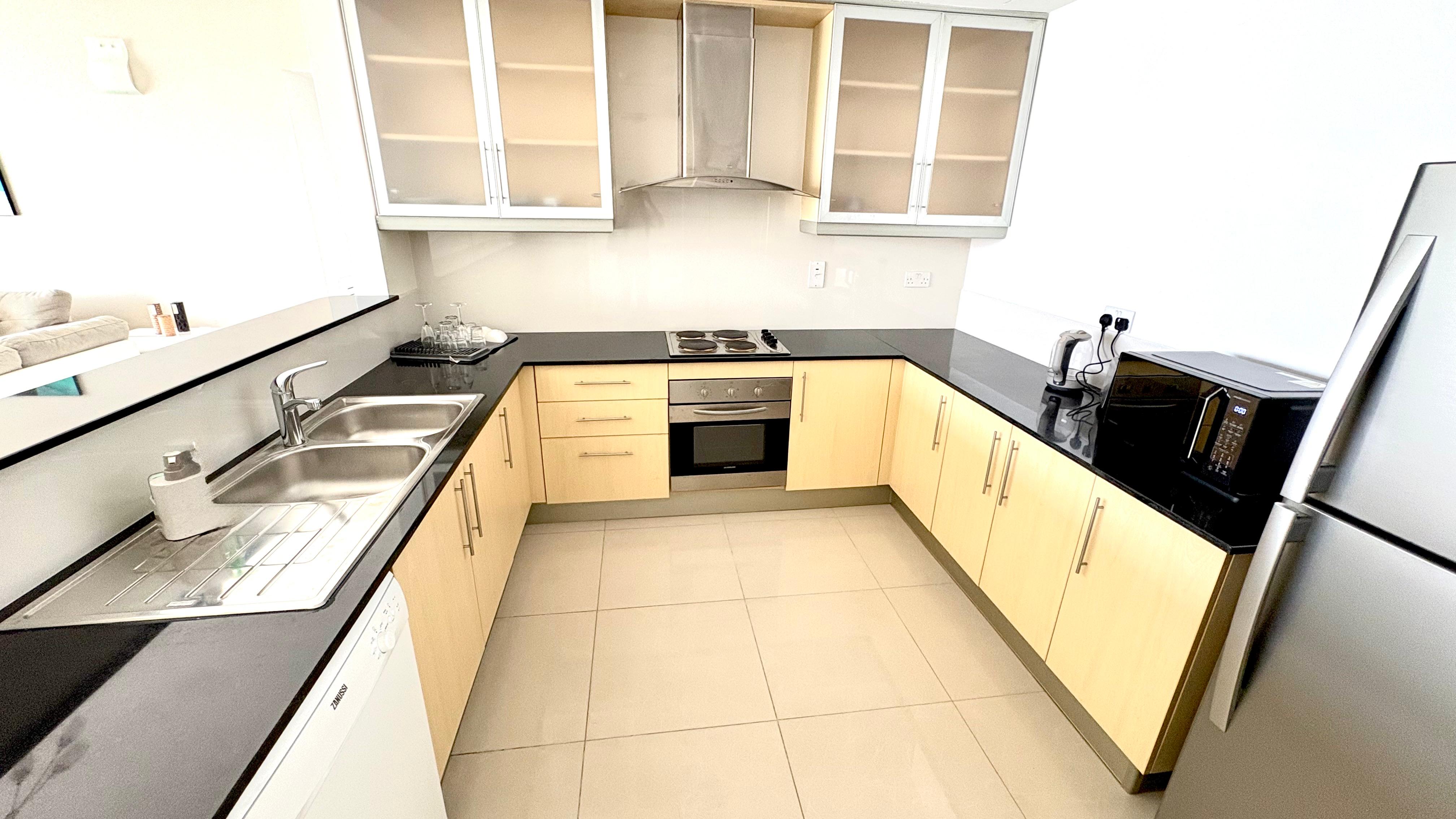 Modern 2BR Apartment | Pool, Gym & Covered Parking